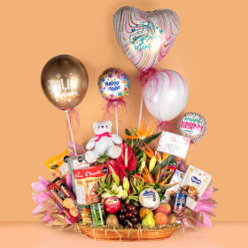 Ancheta gigante con flores exoticas y frutas surtidas con productos gourmet y globos