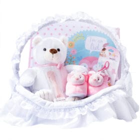 Canastilla para niña con oso de peluche cuchara de silicona y babuchas