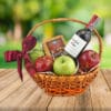 canasta de manzanas saludable para regalar con vino tinto casillero del diablo y queso tilsit